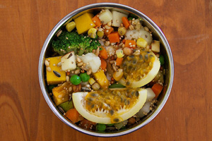 best-fresh-foods-eclectus-parrots Eclectus parrot eating a bowl of fresh vegetables and sprouts